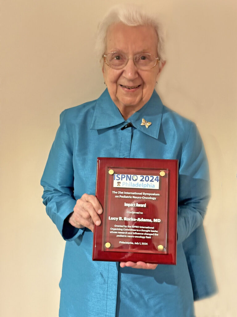 Dr. Lucy Rorke-Adams with plaque